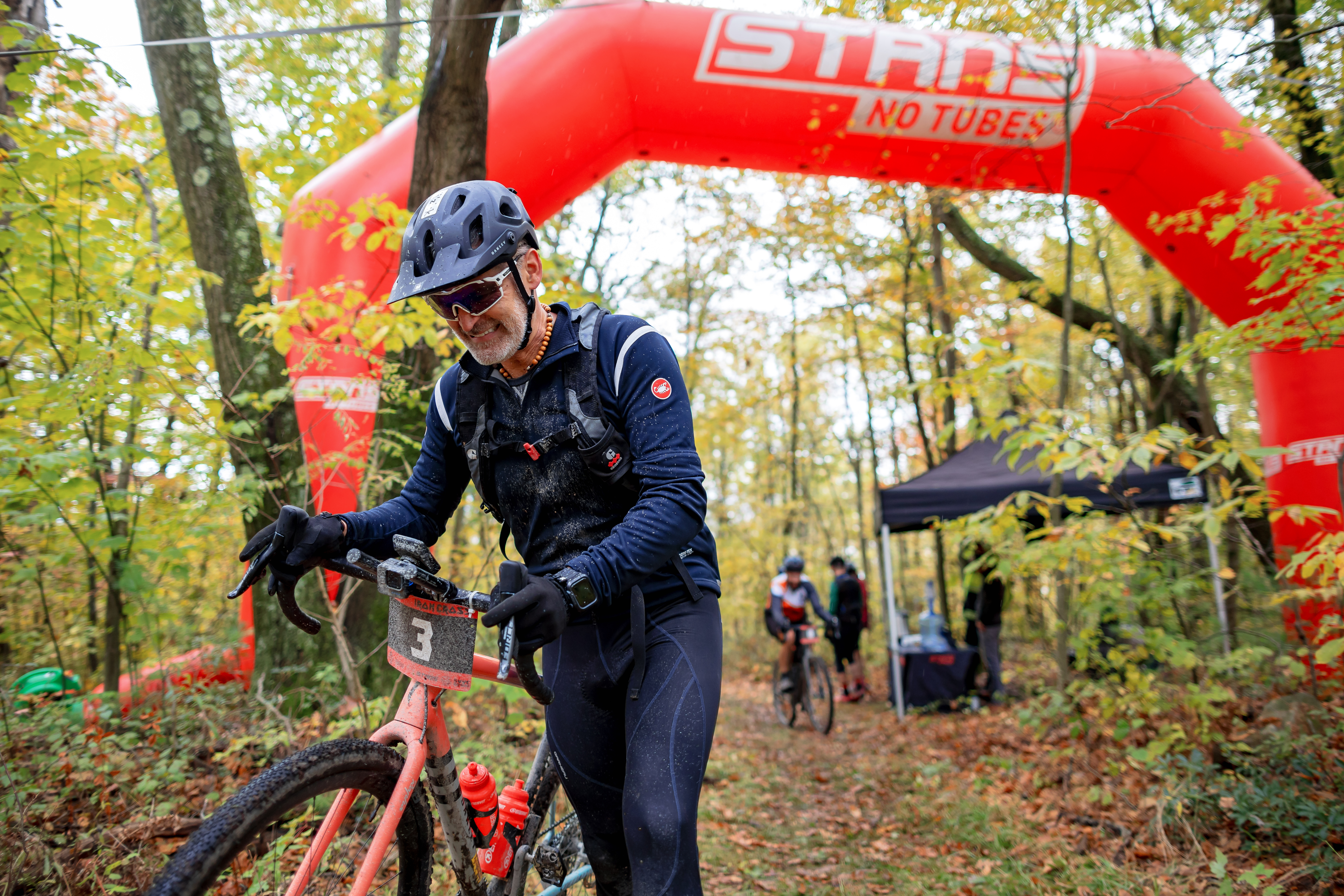 Iron Cross racer beneath Stan's NoTubes finish line arch.